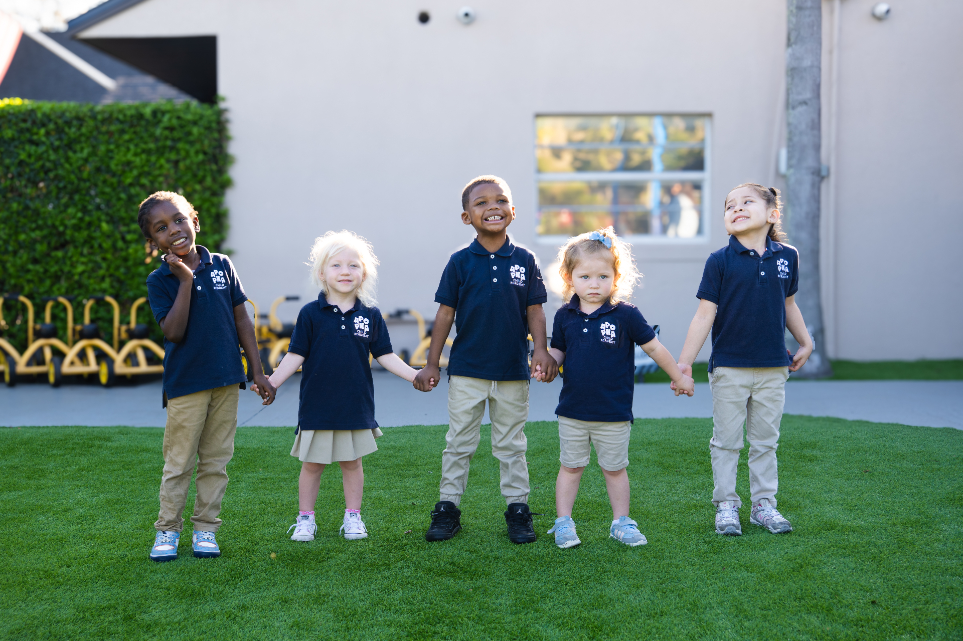 Apopka Child Academy students in uniform on the playground